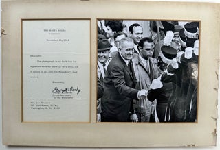 Item #67998 Photograph of President Lyndon Johnson shaking hands with a [marching?] band member.;...