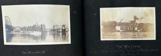 RECORD OF A CANOE TRIP DOWN THE ALLEGHENY RIVER FROM OLEAN, NEW YORK TO PITTSBURGH, PENNSYLVANIA, 1919; AND A SECOND TRIP FROM MAYVILLE, NY TO PITTSBURGH IN 1920, COLLECTED IN A PAIR OF PHOTO ALBUMS, SOME 270 BLACK & WHITE PHOTOS OF A GROUP OF YOUNG MEN TESTING THEIR SKILLS JUST AFTER THE END OF WORLD WAR I. Accompanied by additional photos of Baum's sporting life in Pittsburgh.